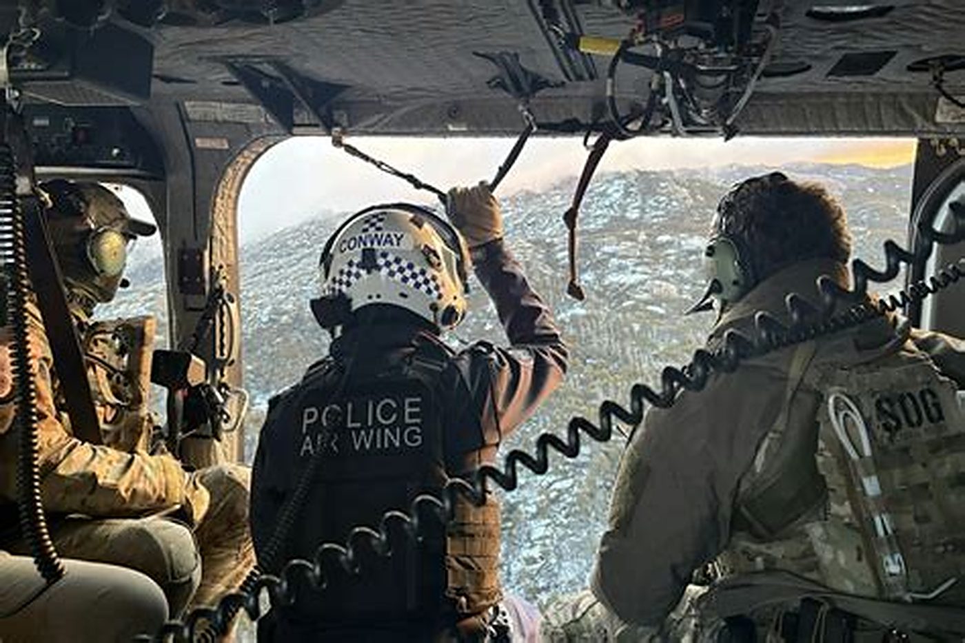 The view from a police helicopter over snow-dusted ranges.