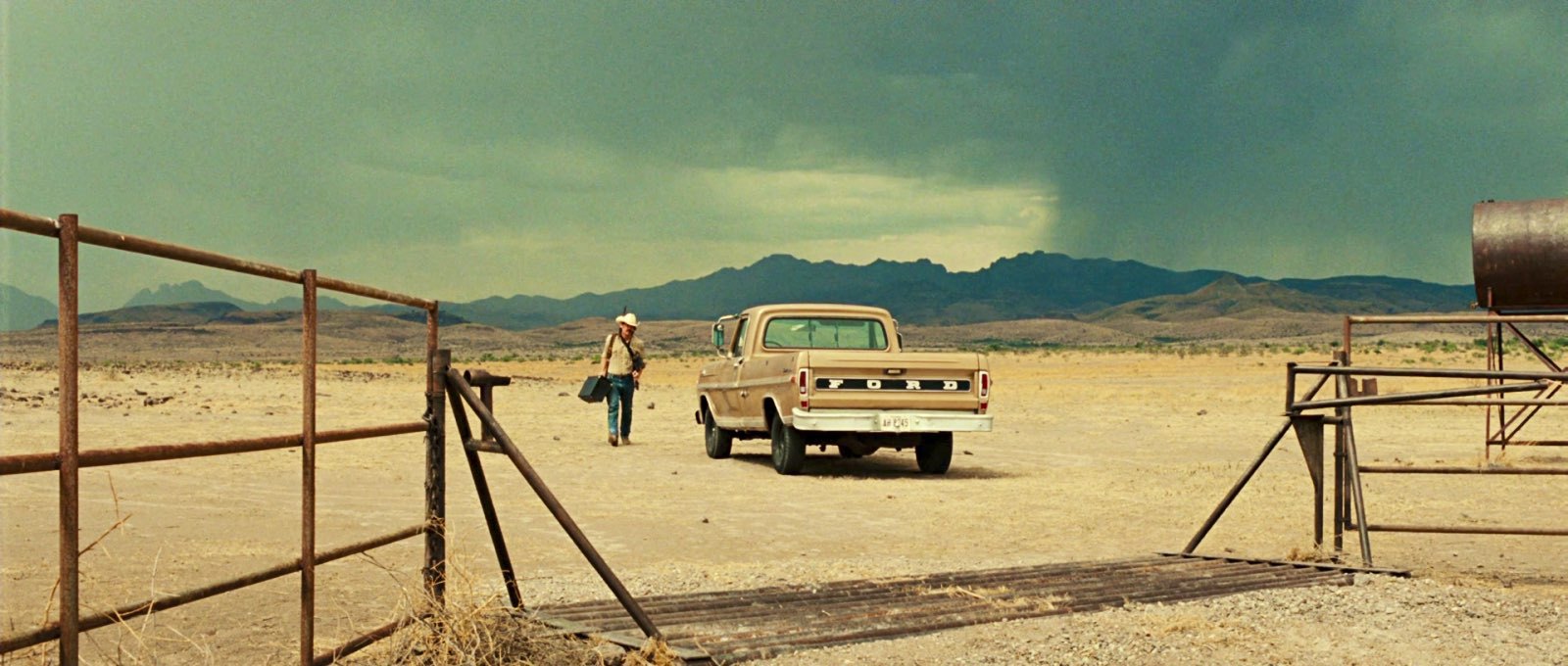 Cinematic reference frames: weathered light in rooms and along fence lines.