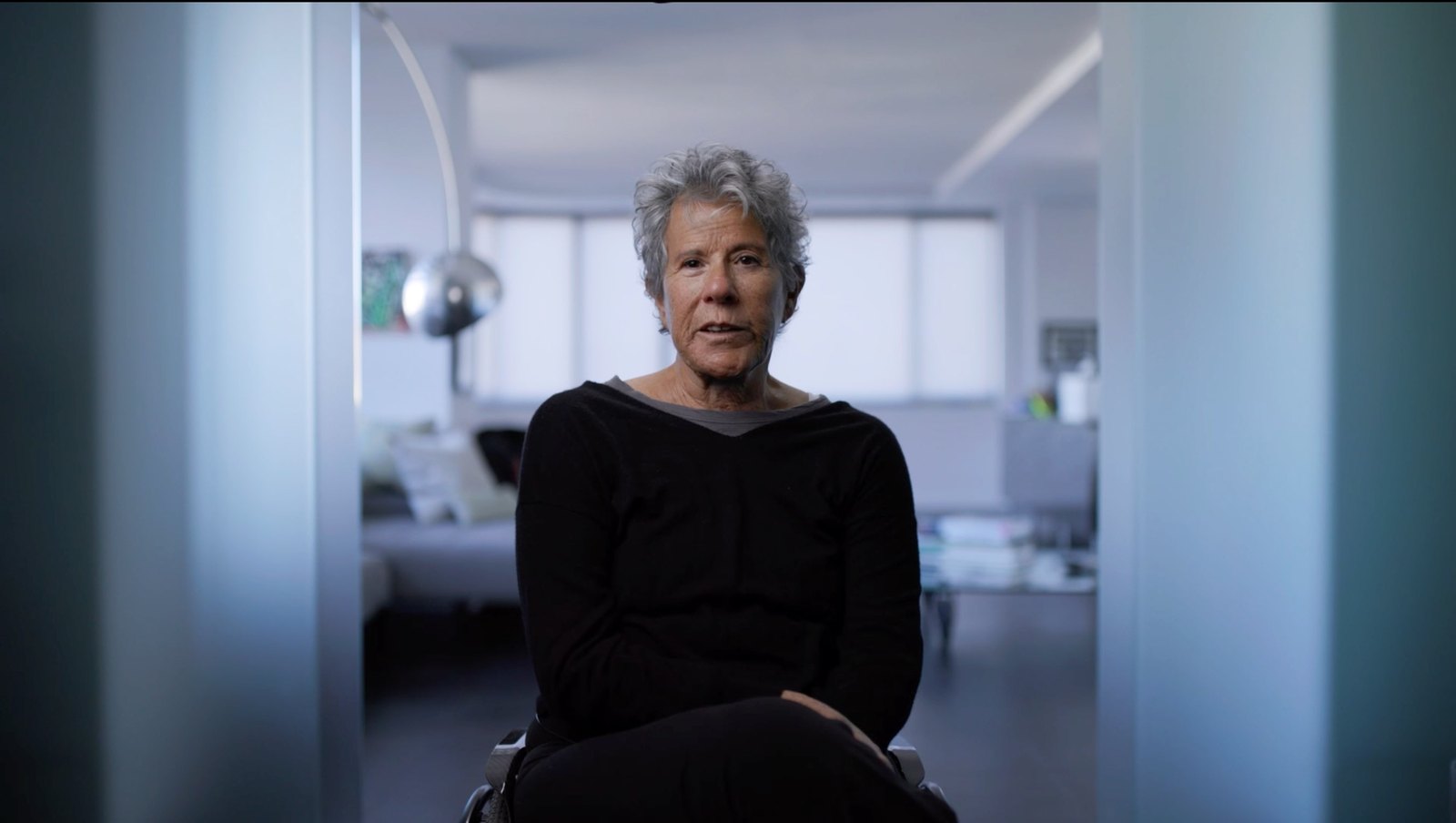 Reference frames for interview camera A: centred portraits where the room is part of the character.