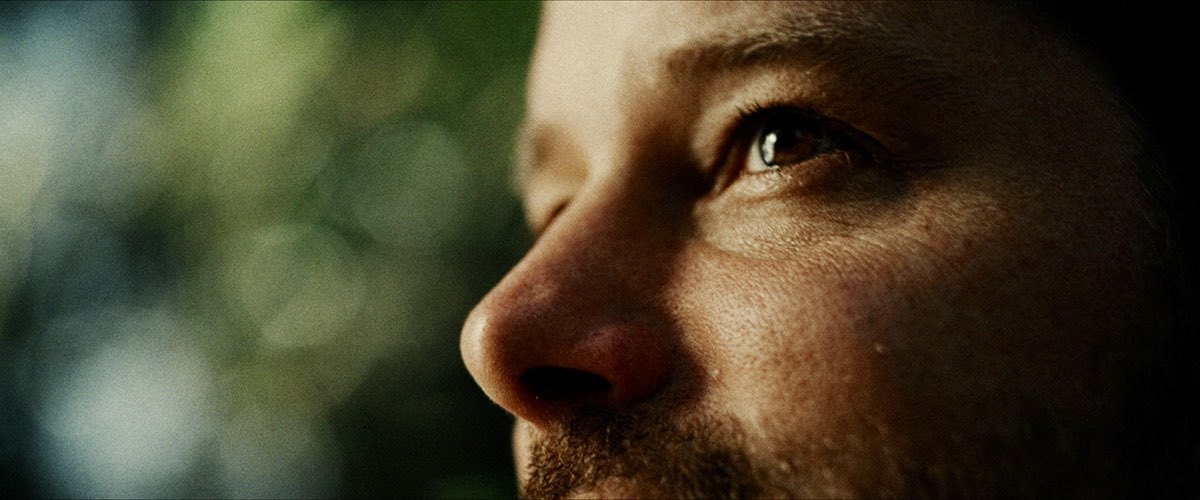 Reference frames for interview camera B: long-lens close-ups with shallow depth of field.