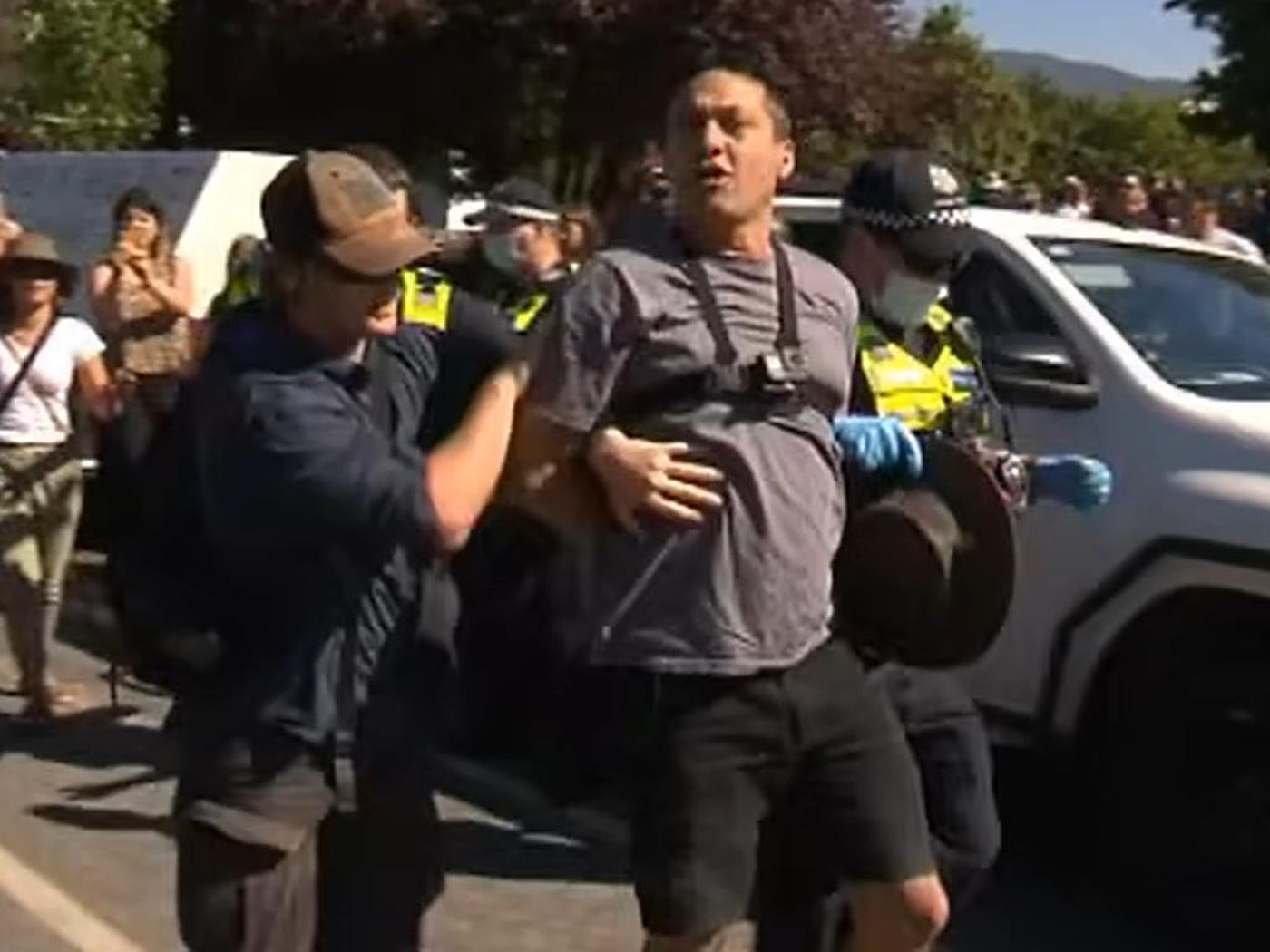 The Porepunkah town sign, with the police identification photo inset as the media ran it.