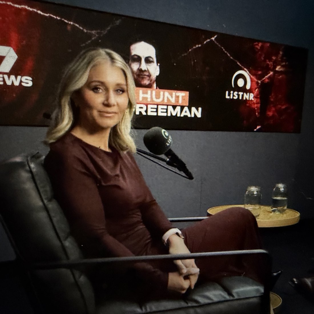 Cassie Zervos in the studio, the Hunt for Freeman story board behind her.